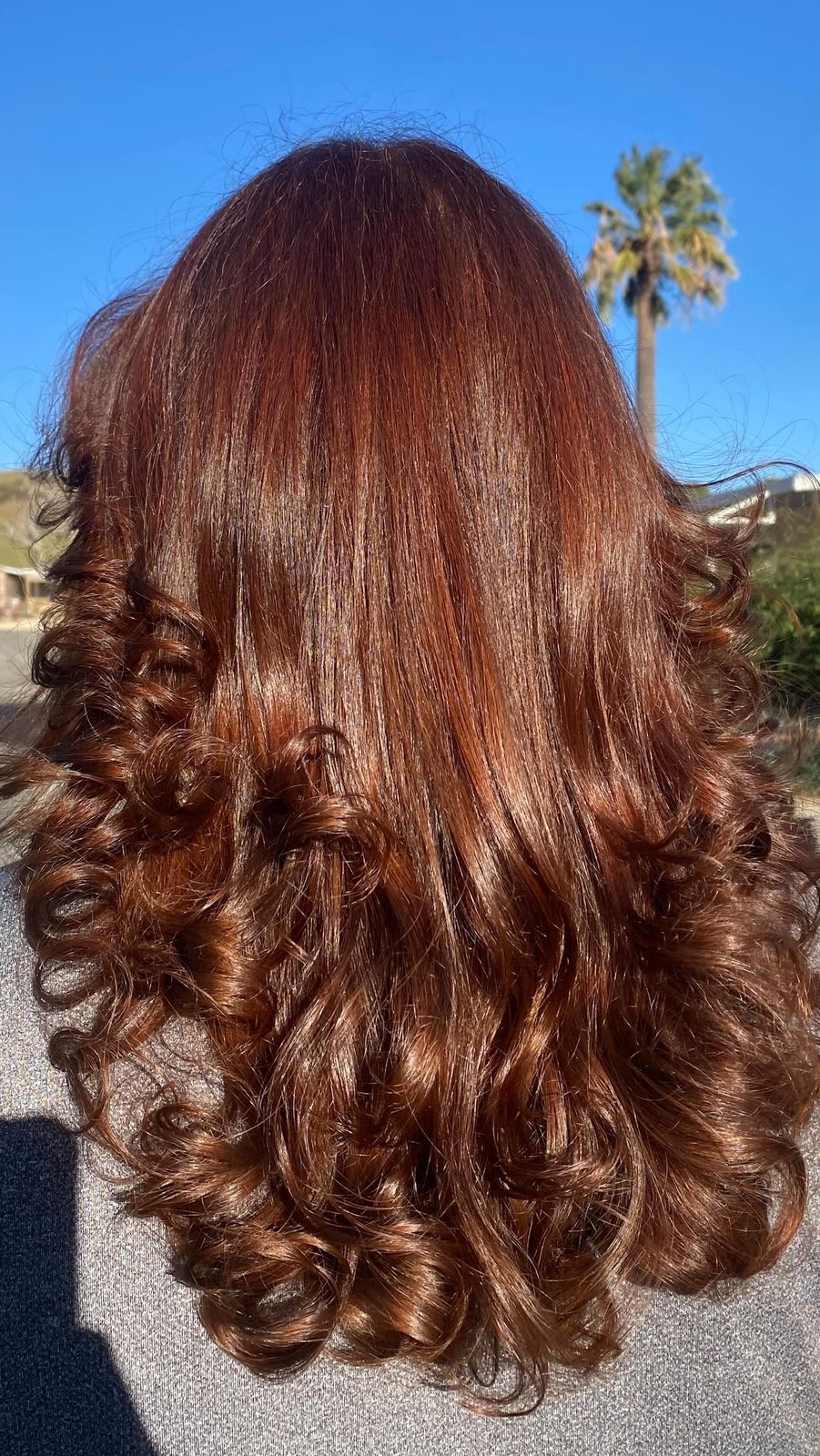 Cowgirl copper: long copper-red color finished with big bouncy curls